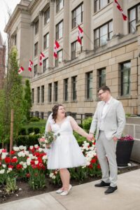 Bride and groom in front of London Life Building