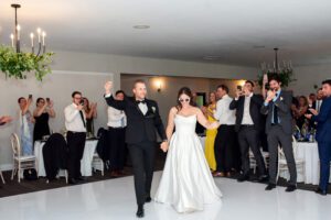 Bride and groom entering their reception at Forest City National in London Ontario.
