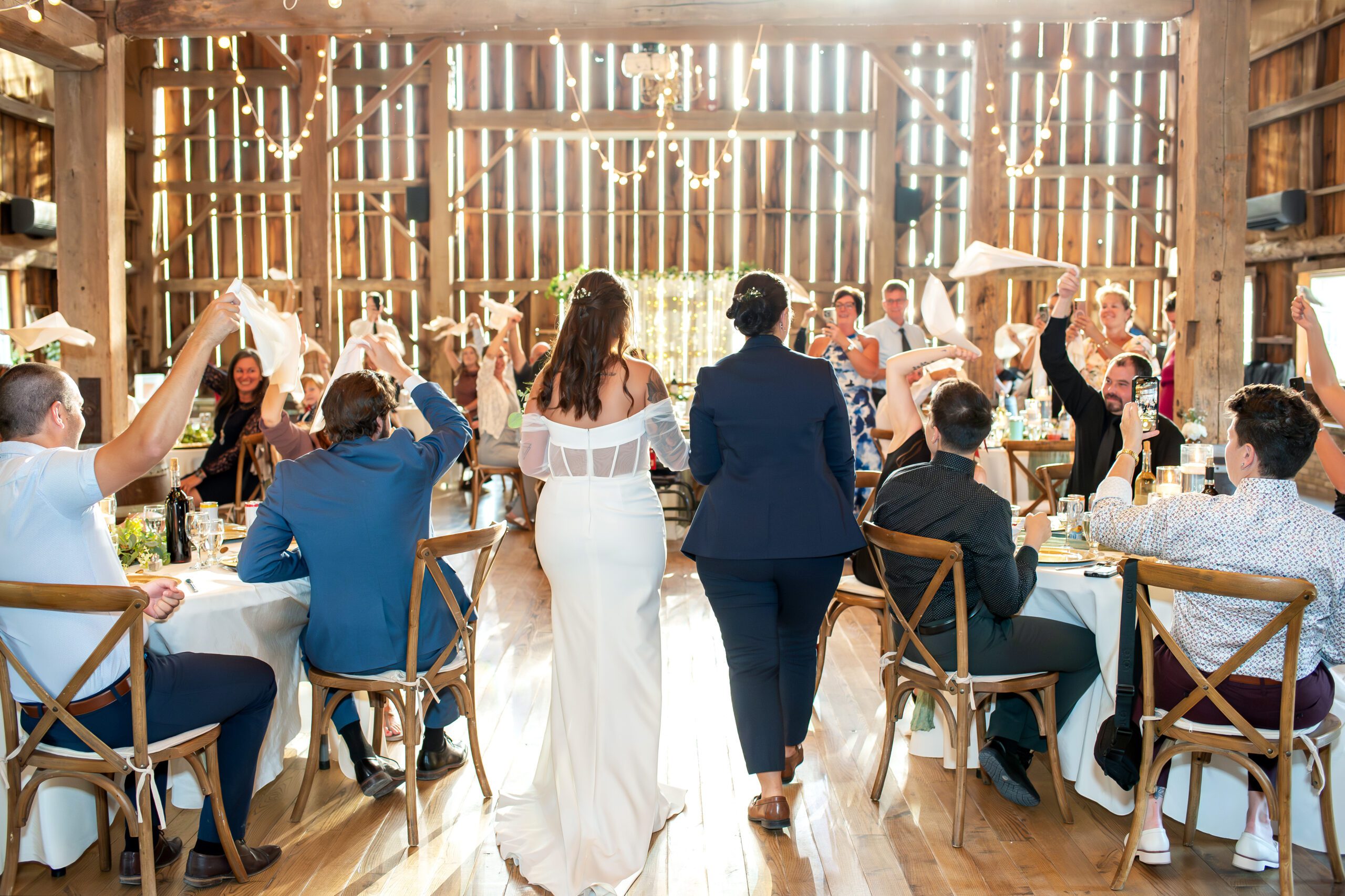 Brides walking into their wedding reception at Sydenham Ridge Estates.