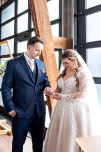 Couple admiring rings after signing at Crescent Hill Acres.