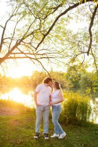 Couple nose to nose by the river at golden hour in Stratford Ontario.