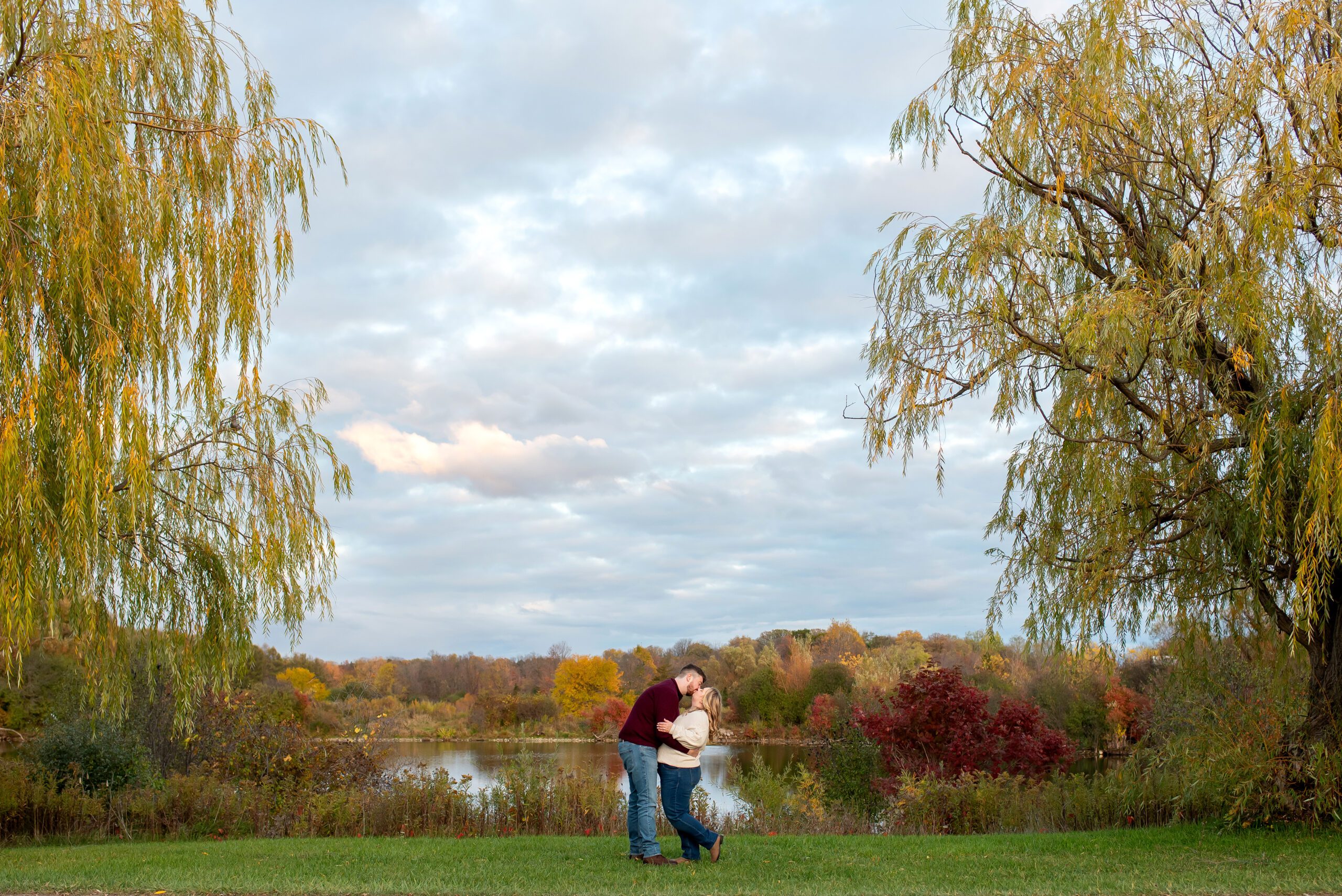 Couple kissing and dipping at Fanshawe Conservation Area.