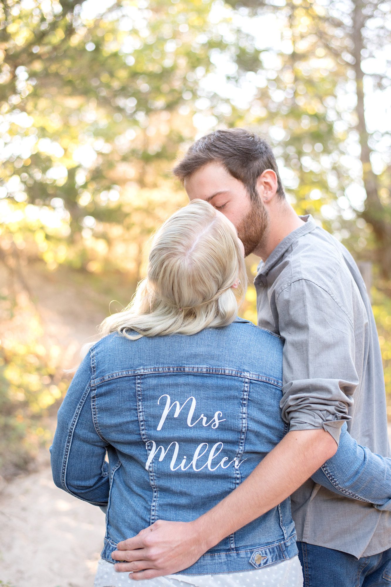 couple close of up jean jacket with future name