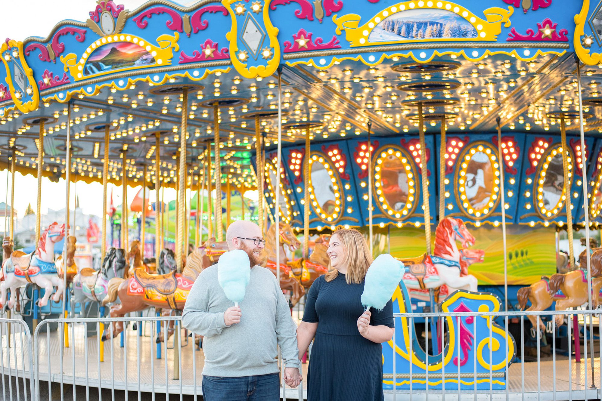 couple with cotton candy at the fair