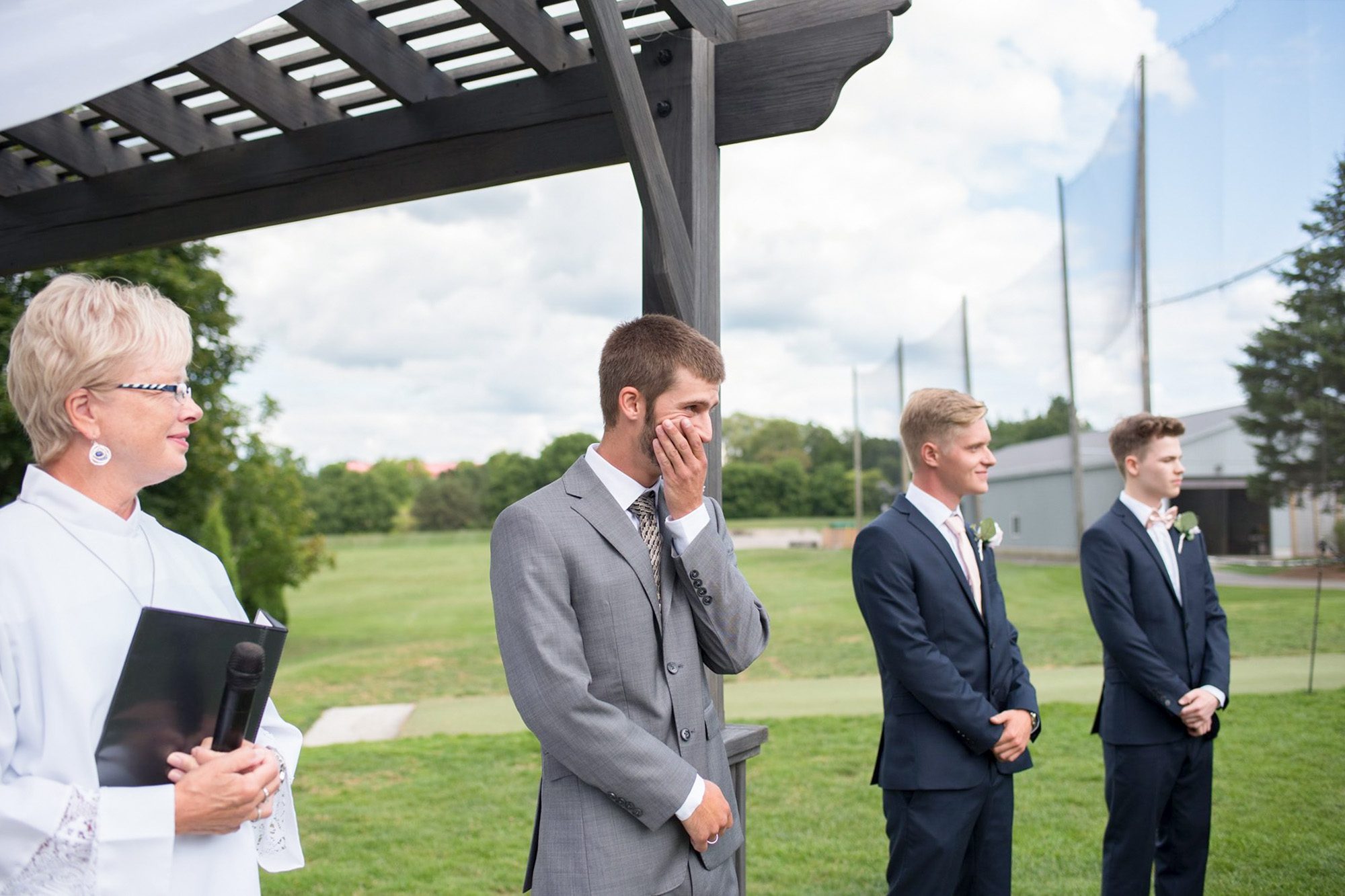 groom seeing bride for first time at ceremony