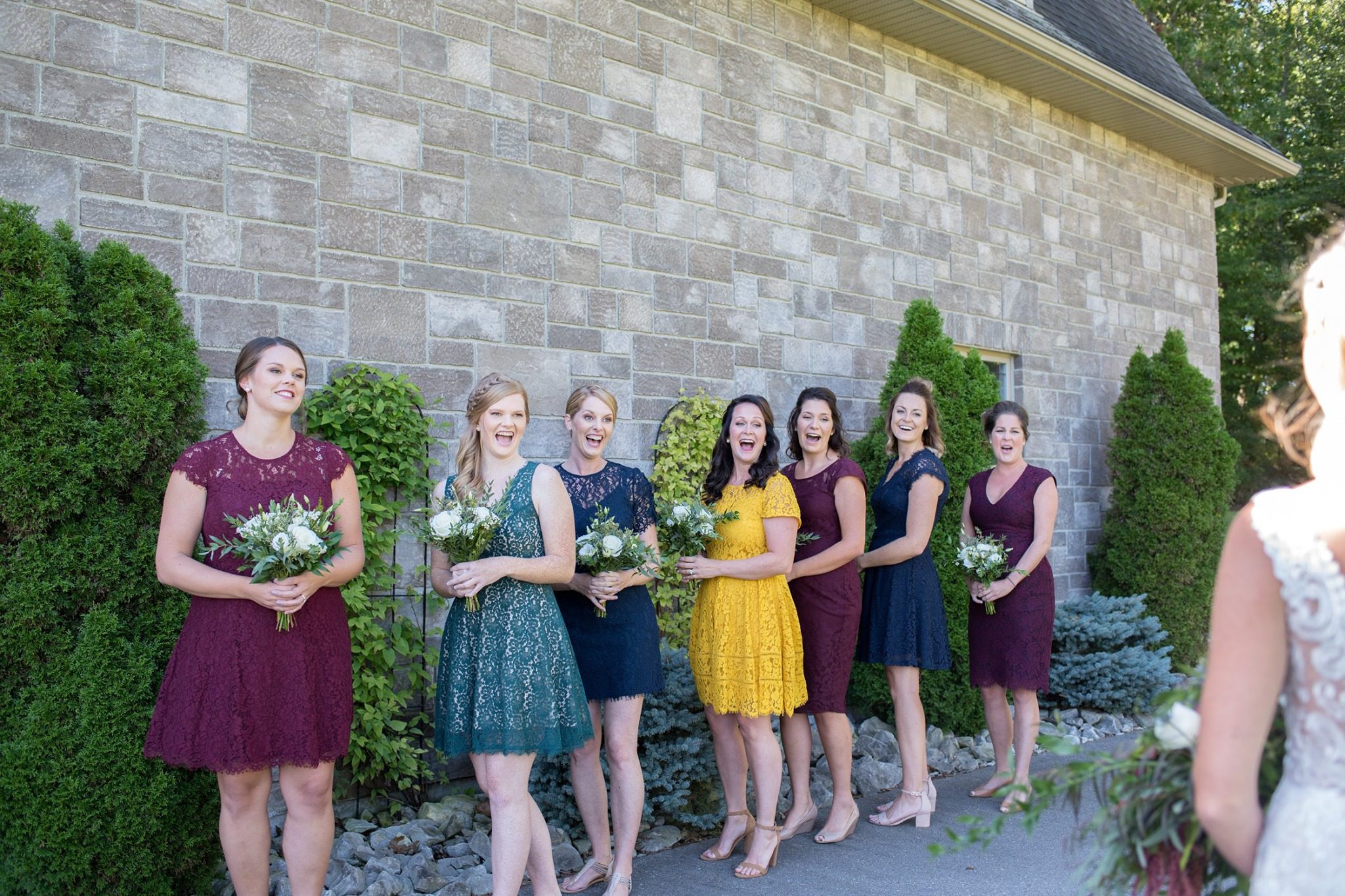 bridesmaids seeing bride for first time on wedding day
