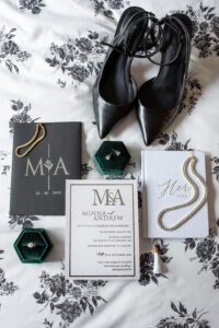 Layflat of bridal details such as invitations, ring, jewelry and shoes.