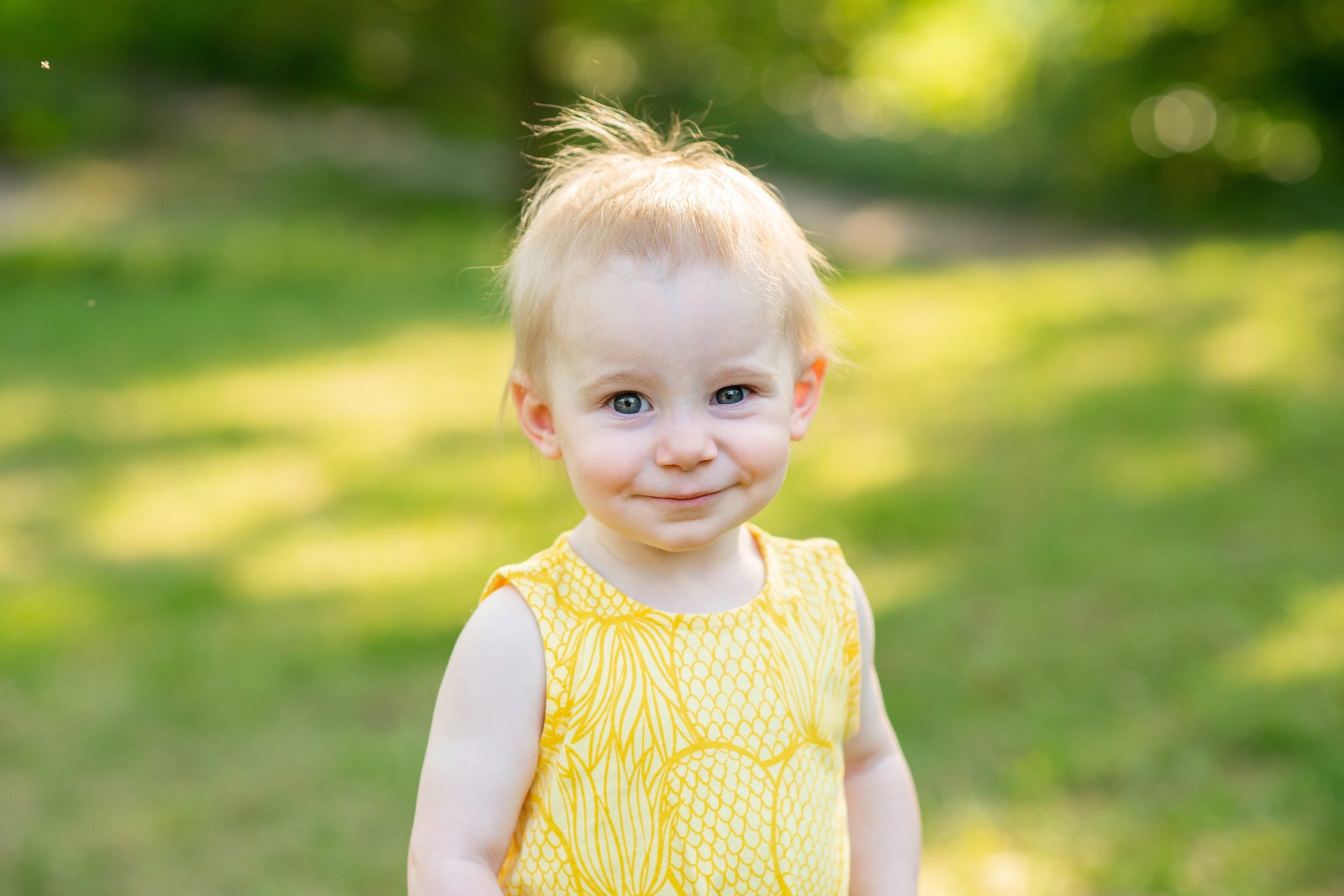 Little girl looking at camera and smiling at Civic Gardens