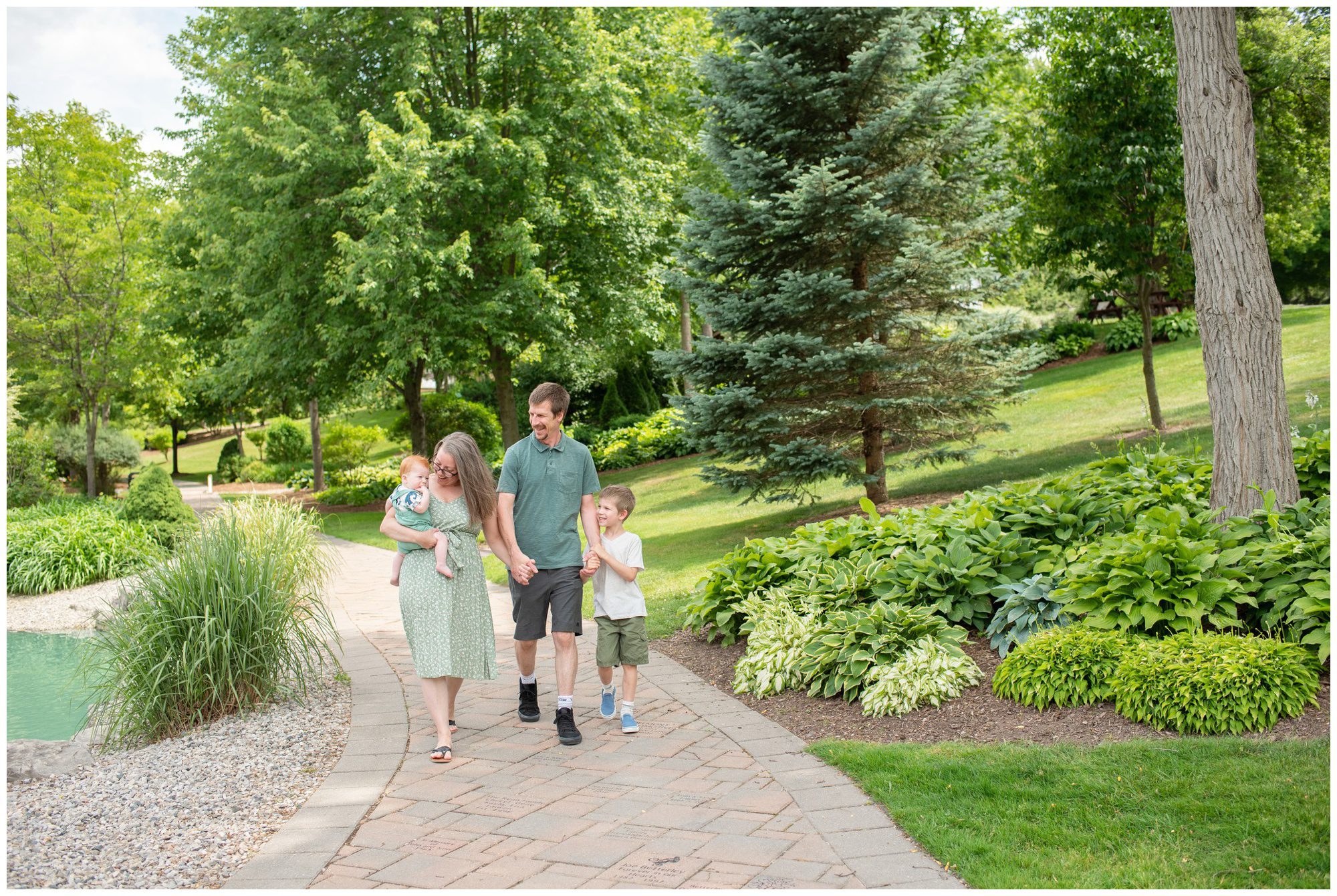 Family of 4 walking together in Belmont Ontario.How to keep family photos fun & easy