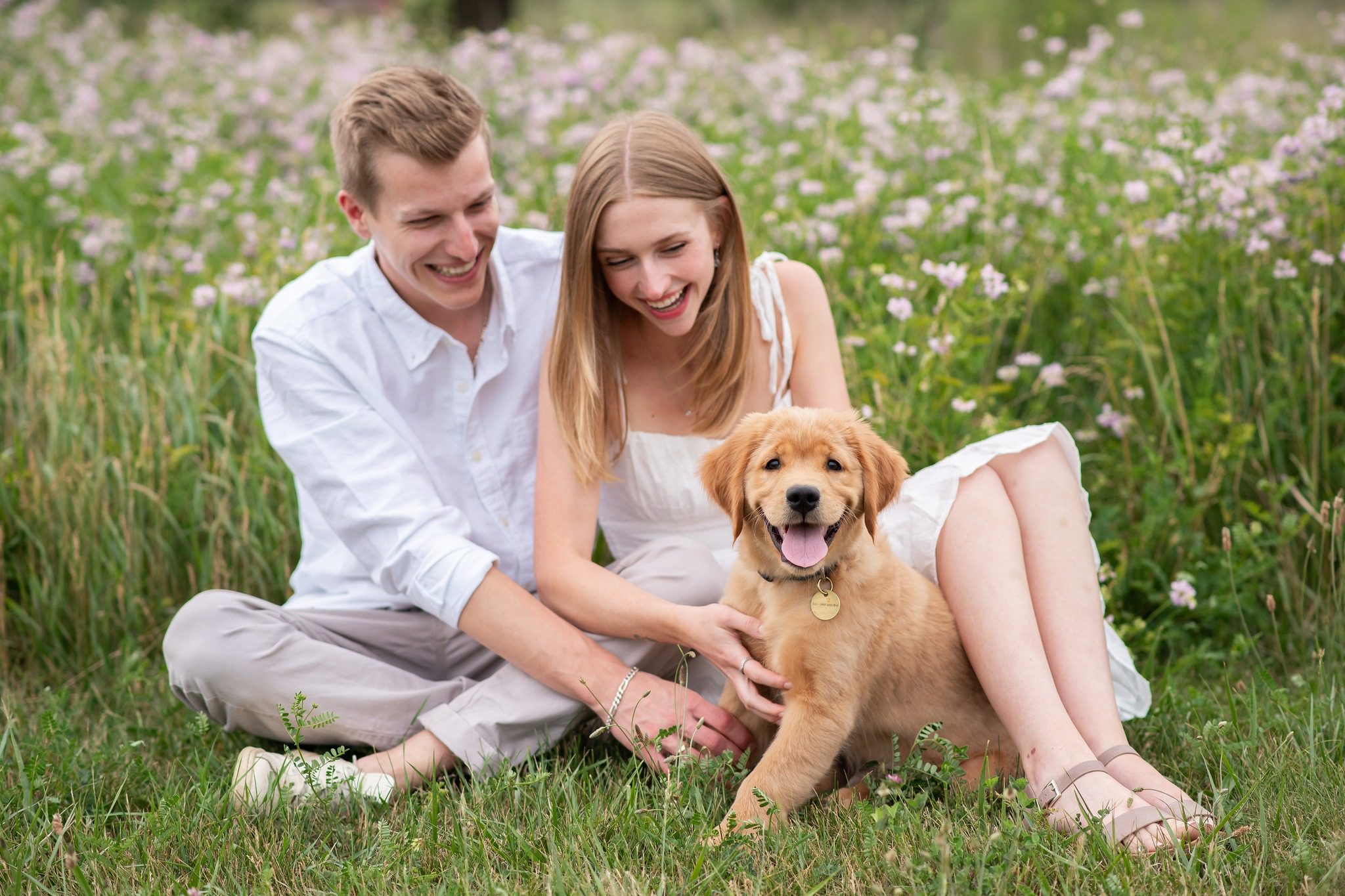 Couple with 12 week old golden retriever puppy at Fanshawe Conservation Area