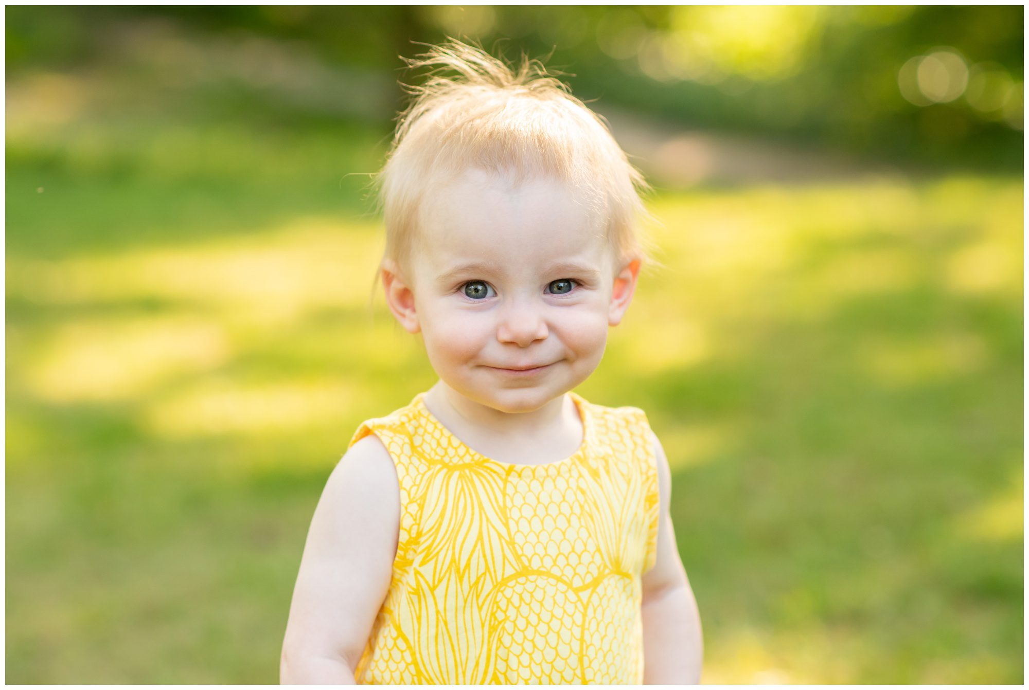 Little girl smiling at camera at Civic Gardens in London Ontario