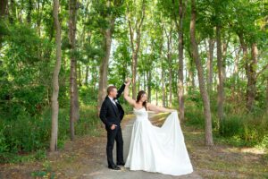 Groom twirling bride at Forest City National.