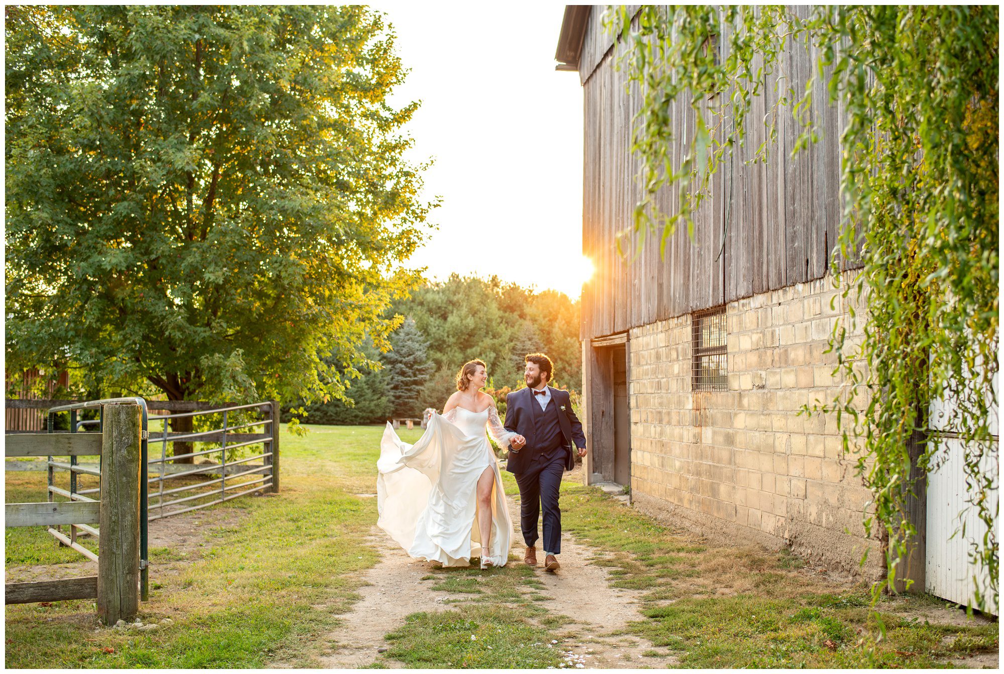 Bride and groom running towards the camera at golden hour at Quiet Earth in Dorchester Ontario.