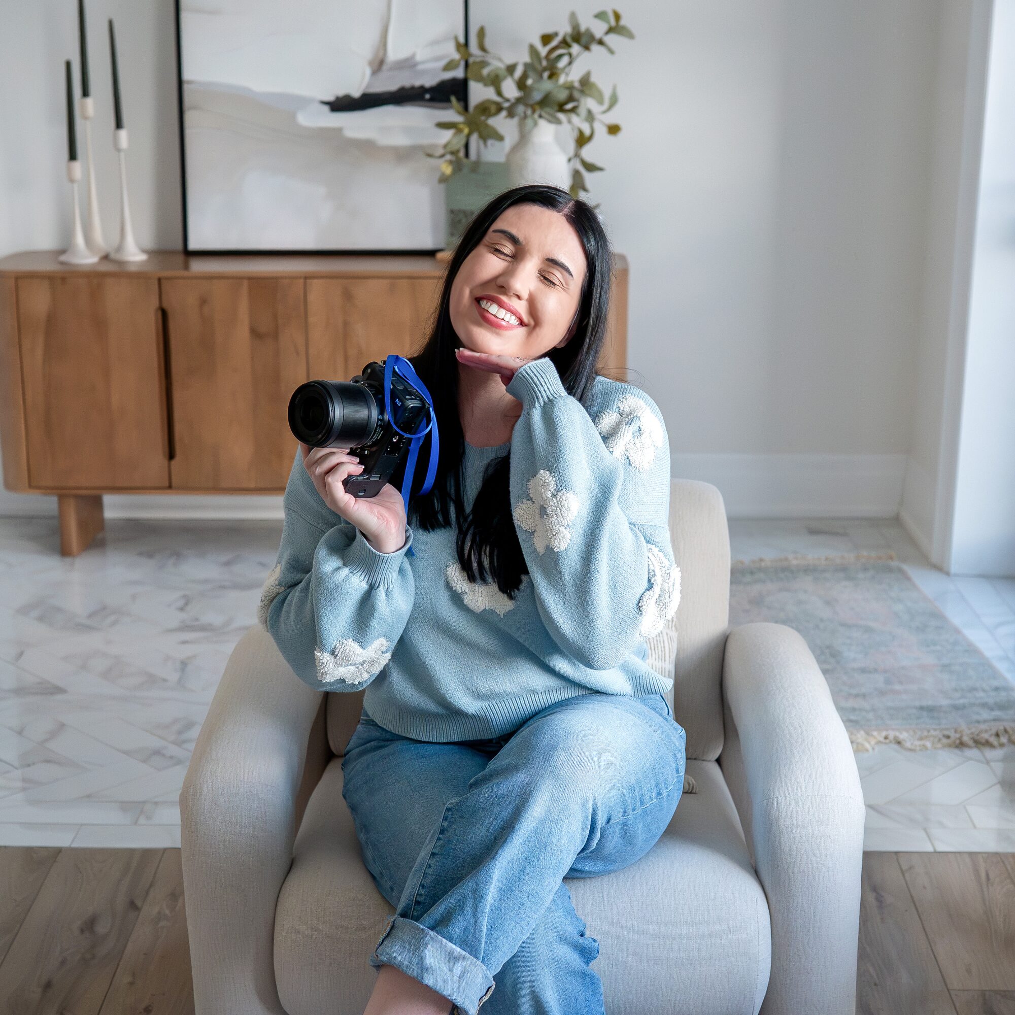 Michelle of Michelle A Photography holding her camera at Lumen House in London Ontario