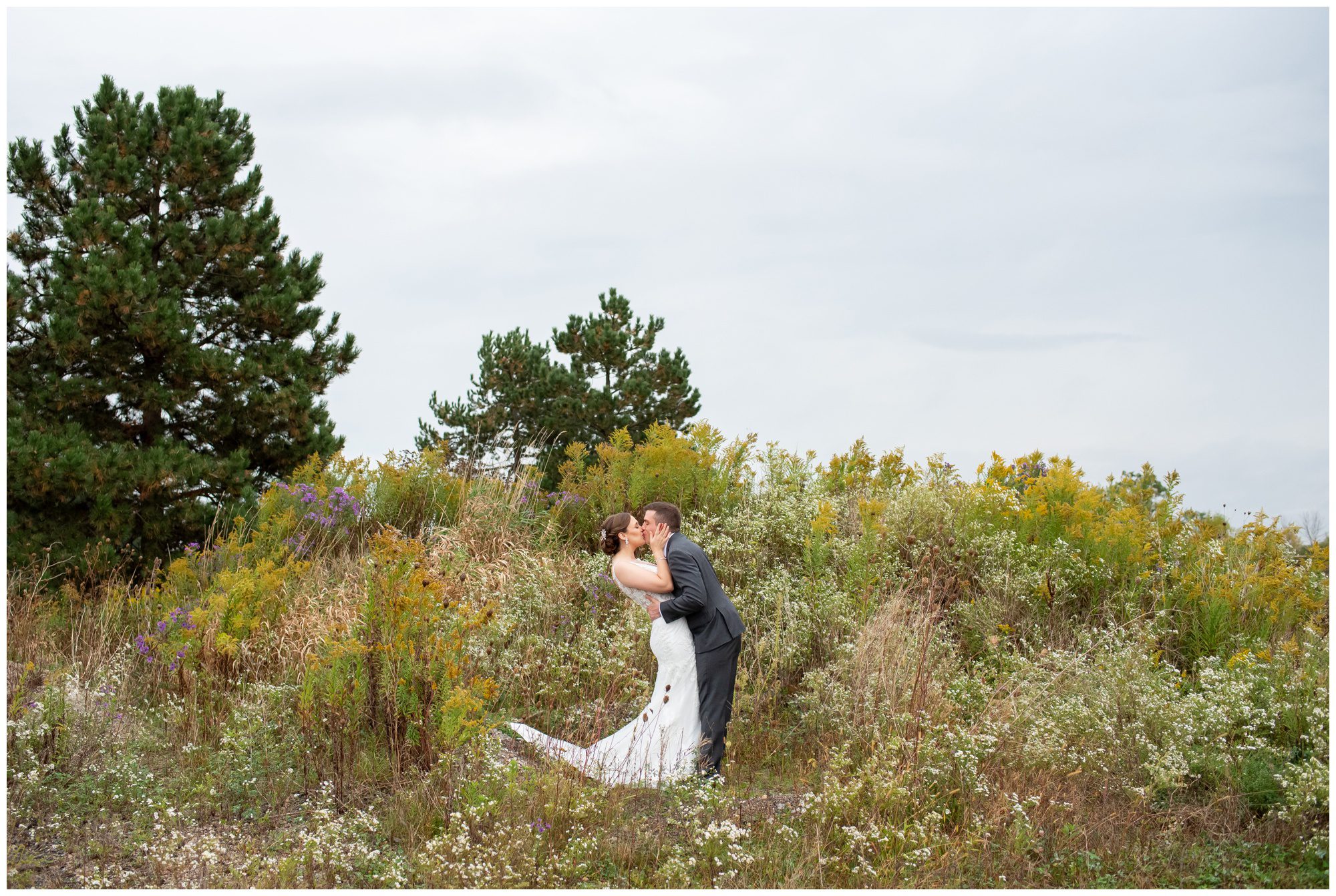 Bride and Groom kissing and dipping at The Rose Chapel and Best Western Stoneridge Inn in London Ontario.